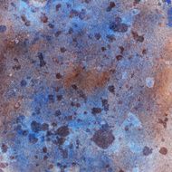Textured watercolor painting with blue and brown splatters