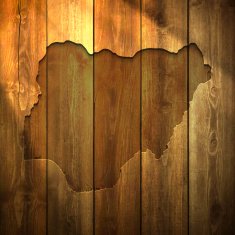 Nigeria Map on lit Wooden Background