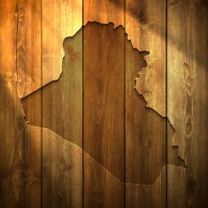 Iraq Map on lit Wooden Background