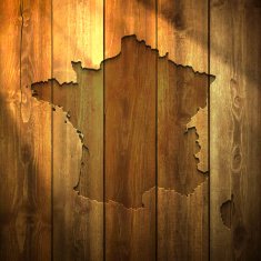 France Map on lit Wooden Background