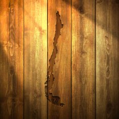 Chile Map on lit Wooden Background