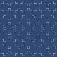 Embroidery ornament with white geometric abstraction on blue jeans background N2