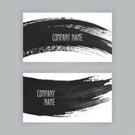 two business cards with brush strokes