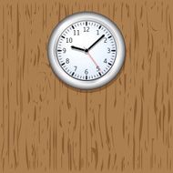 Wall clock on wooden background