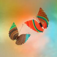 colorful butterflies above watercolors on textured paper N2