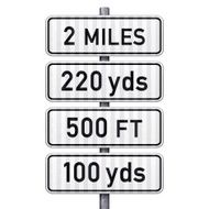 White traffic signs indicating distance (imperial)