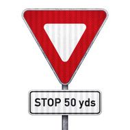 Triangular road sign with 50 yards ahead to stop
