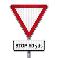 Triangular road sign with 50 yards ahead to stop N2