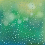 Water Drops on Glass Green Blur Background
