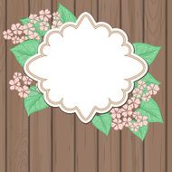 Retro label with pink flowers over wood