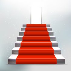 Stone ladder with red carpet and open door