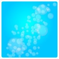 soap bubbles of different size on light blue background