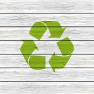 Wooden background with recycling symbol