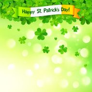 Green clovers on shining bokeh effect background with Irish flag