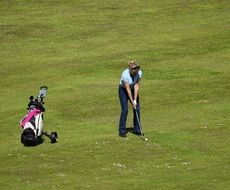 female in the golf club