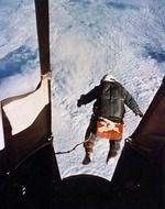 altitude record, historical photo of parachutist jumping out aircraft
