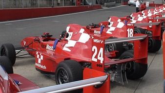 Red and white racing cars