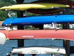 stacked colorful kayaks