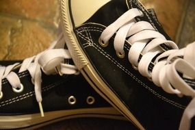 Pair of athletic shoes with white laces