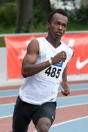 runner running around the stadium in athletics