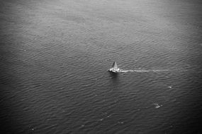 yacht in the sea in black and white