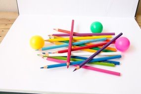 color pencils and balls on paper for creativity