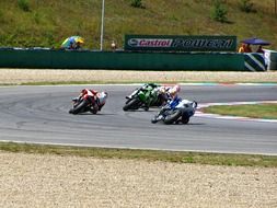 motorcycles ride at speed on the highway