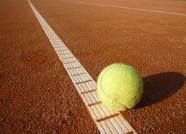 green ball on the tennis field
