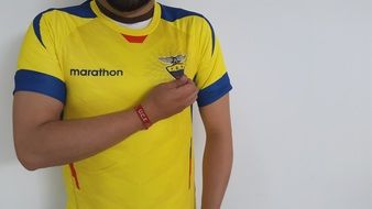 sportsman in t-shirt of ecuadorian football team