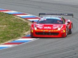 race car rides on the edge of the track