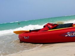 red kayak on the sea coast