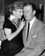 black and white portrait of Lucille Ball and John Wayne