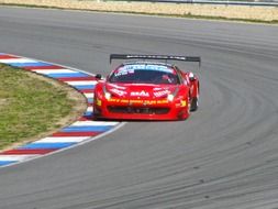 Colorful car goes on the track in the race