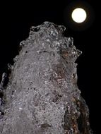 fountain on the background of the moon