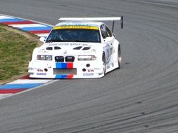 white race car on the outskirts of the track, brno