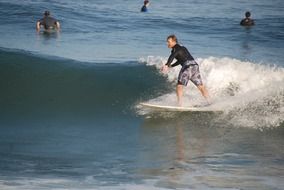 surfer taking a wave
