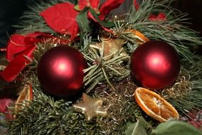 Christmas wreath with red balls and orange slices