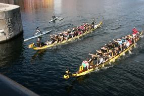 panorama of competitions on canoes on the river