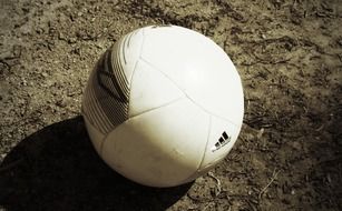 white football on ground