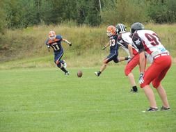 players play american football on the field