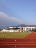 sports ground in front of the university