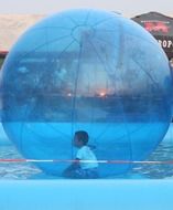 walking kid in a ball