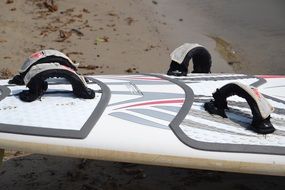 Surfboard on the shore closeup