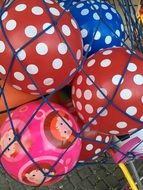 multicolored children's balls in the grid