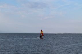 windsurfing while wind at sea
