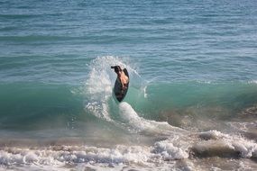 surfer on the wave of the coastal ocean