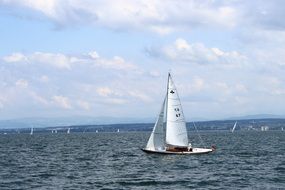 ship with white sails on Lake Constance