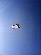 Extreme kitesurfing in the blue sky