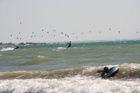 kiteboarding among the waves