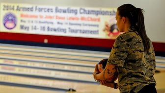 Girl on the path in the bowling alleyway